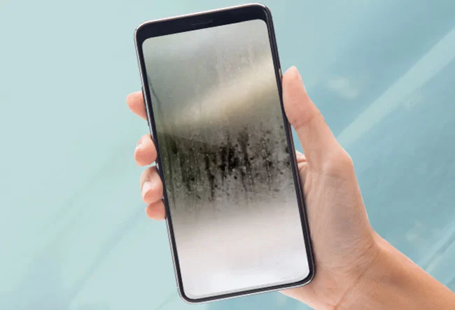 Samsung Galaxy S10e smartphone with a screen that appears to be affected by condensation
